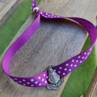 Pulsera virgen del Roco cinta de lunares morado